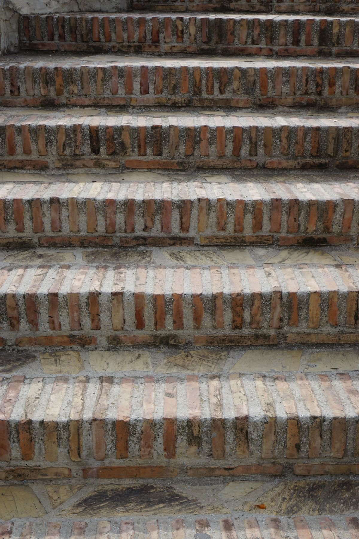 Close-up of handcrafted brick and stone steps